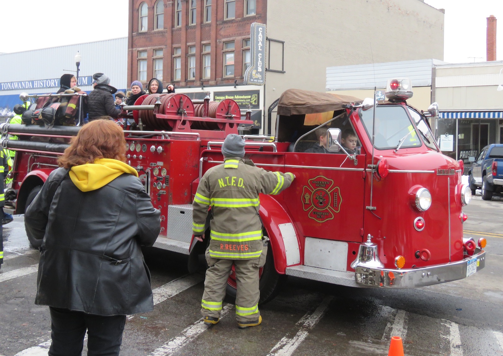 Children get ready to ride the classic North Tonawanda Fire Department truck. The truck made a short journey down Webster Street and around surrounding streets before making its way back in front of the Riviera Theatre. (Photos by David Yarger)